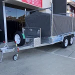 10x6 trailer with cover, ladder racks & toolbox