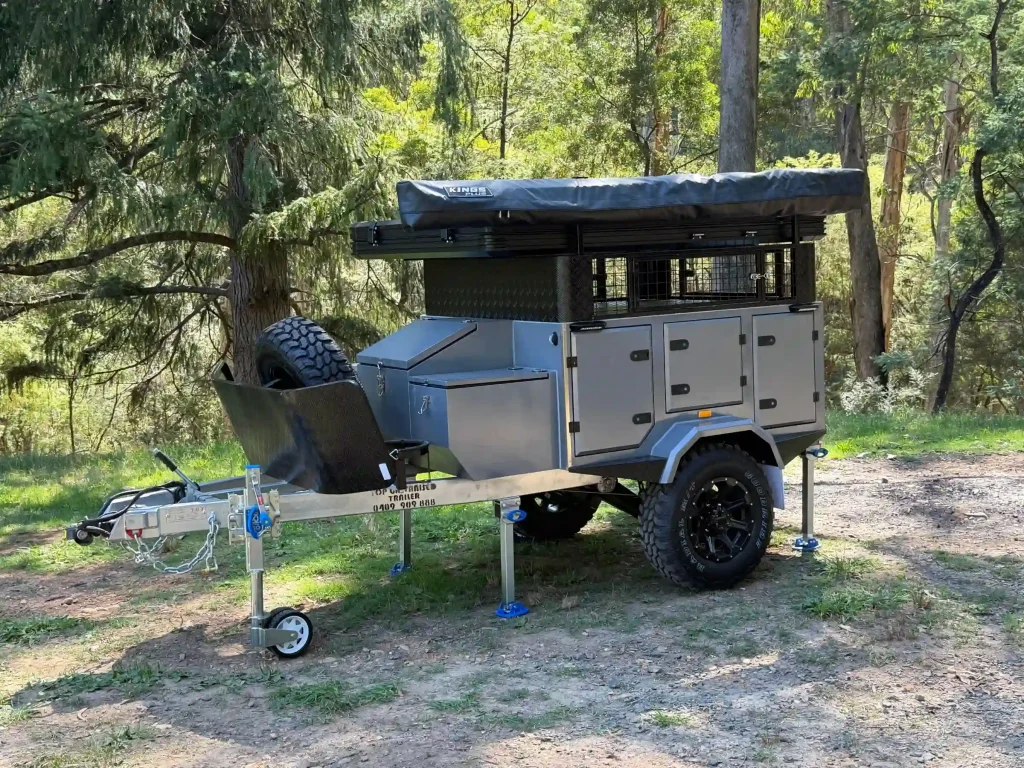 camper trailer with roof top tent and awning