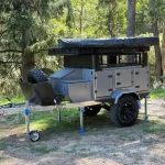 camper trailer with roof top tent and awning