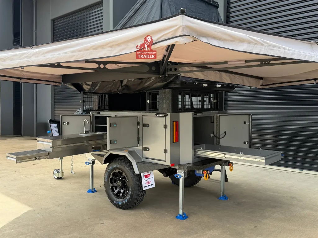camper trailer with rooftop tent and awning